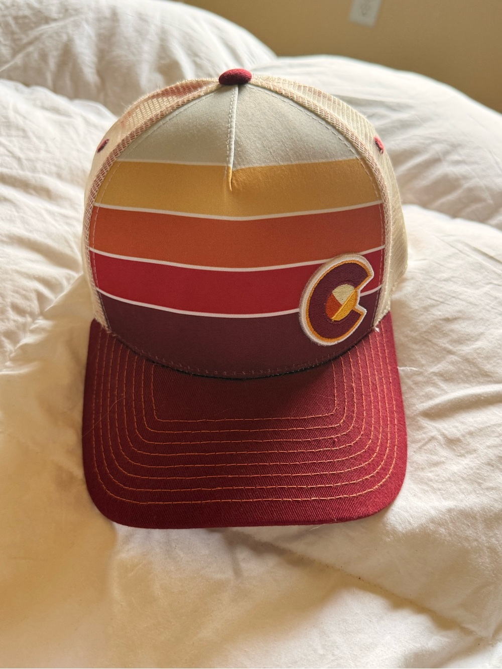 Striped Trucker Hat with Maroon Brim and Sunset Stripes